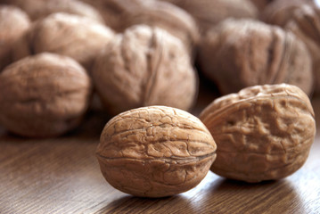 walnuts on the wooden-table.Walnut, Nut - Food, Variation, Food, Seed