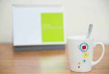 cute coffee cup on workspace.