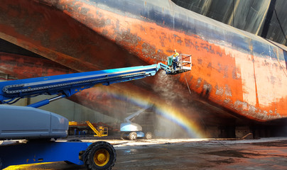 washing of ship hull at drydock - obrazy, fototapety, plakaty