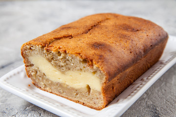 Sliced banana bread with cream cheese