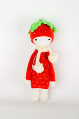 soft toy crochet a red strawberry in a white cap and scarf