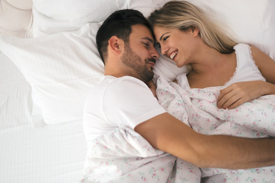 Romantic Couple In Bed In Nightwear