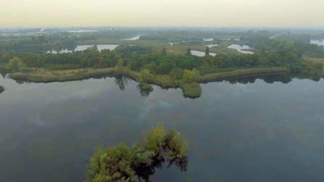 Nature sanctuary - network of lakes and meadows. Aerial view, long shot. Fen Drayton, Cambridgeshire, UK