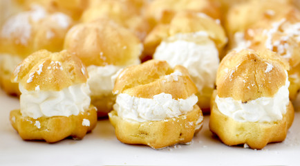 Cream puff cakes with custard in a white box