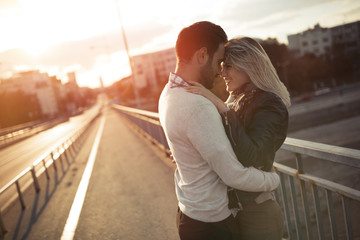 Romantic couple in love enjoying sunset