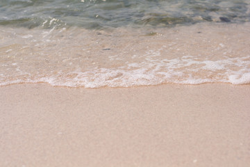 Wave of the sea on the sand beach