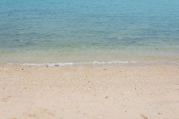 Wave of the sea on the sand beach