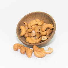 cashew nut in wood bowl on white
