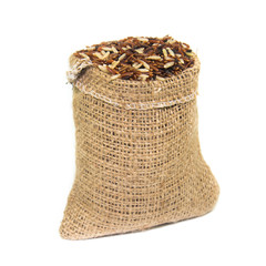 brown rice in jute bag ion white