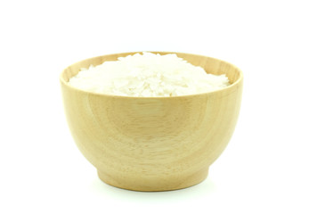 Rice in woodbowl on white background.