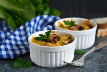 Baked chicken with mushrooms in a cream sauce with cheese