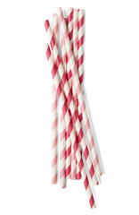 Obraz premium A pile of red and pink striped paper drinking straws isolated on a white background