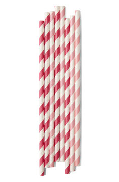 A pile of red and pink striped paper drink straws isolated on a white background