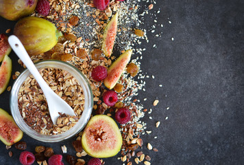Morning breakfast - granola, honey, berries and fruits. 
