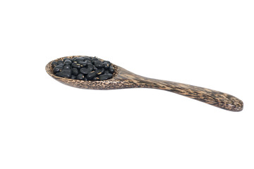 Black beans with wooden spoon isolated on white background..