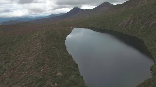 Flying forward above Lake Esperance, Hartz Mountains National Park, Tasmania, Australia