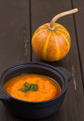 Pumpkin soup on a wooden table