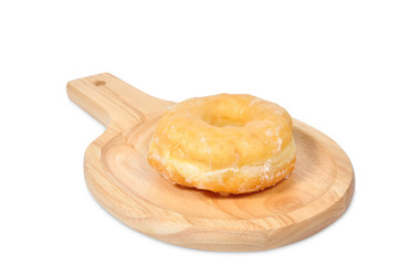 Single donut lay on wooden chopping block