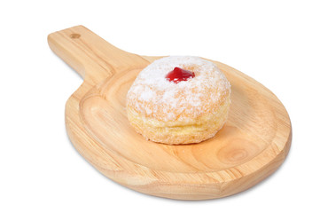 Single donut lay on wooden chopping block