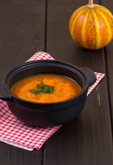 Pumpkin soup on a wooden table