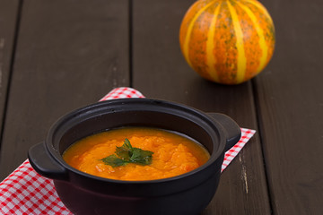 Pumpkin soup on a wooden table
