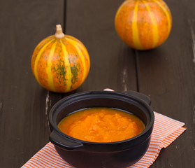 Pumpkin soup on a wooden table