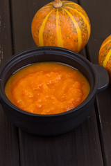 Pumpkin soup on a wooden table