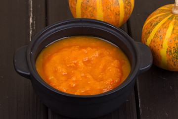 Pumpkin soup on a wooden table