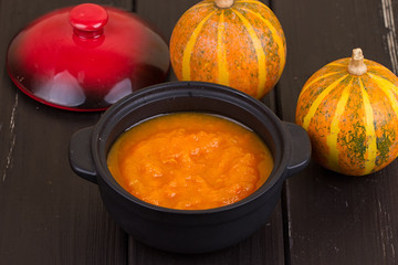 Pumpkin soup on a wooden table