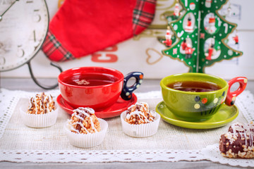 Christmas tea party with cakes, New Year tree with toys, clock a