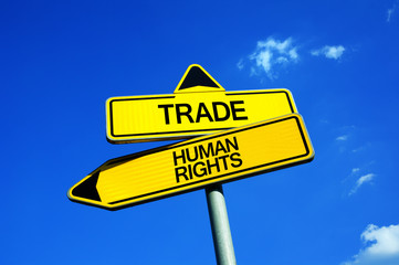 Trade vs Human Rights - Traffic sign with two options - diplomatic dilemma between ethical and economical principle. Freedom, cxploitation and child labor vs free-market