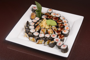 Sushi rolls on a white plate