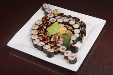 Sushi rolls on a white plate