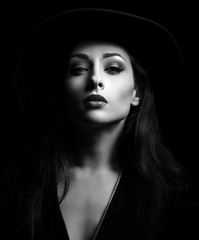 Glamour sexy makeup woman posing in fashion hat on dark backgrou