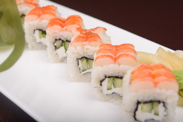 Sushi rolls on a white plate