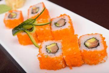 Sushi rolls on a white plate