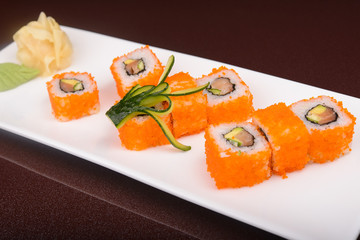 Sushi rolls on a white plate