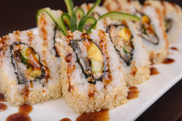 Sushi rolls on a white plate