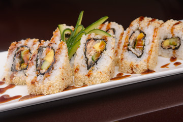Fototapeta na wymiar Sushi rolls on a white plate