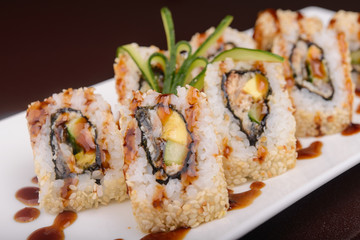 Sushi rolls on a white plate