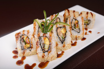 Sushi rolls on a white plate