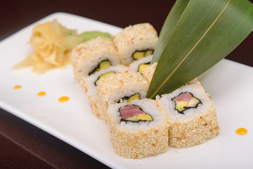 Sushi rolls on a white plate