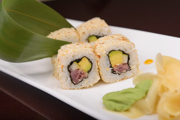 Sushi rolls on a white plate