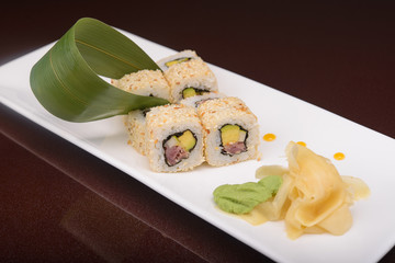 Sushi rolls on a white plate