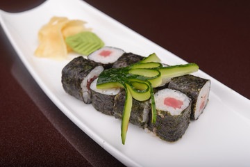 Sushi rolls on a white plate