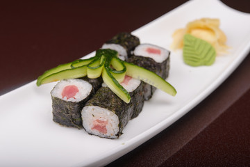 Sushi rolls on a white plate