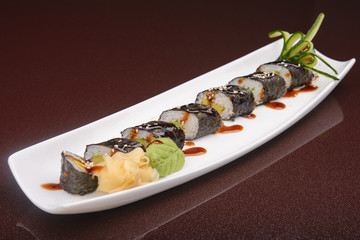 Sushi rolls on a white plate