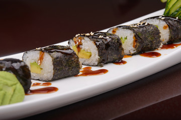 Sushi rolls on a white plate