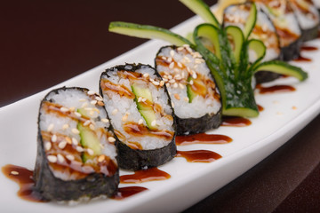 Sushi rolls on a white plate