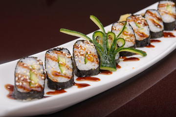 Sushi rolls on a white plate